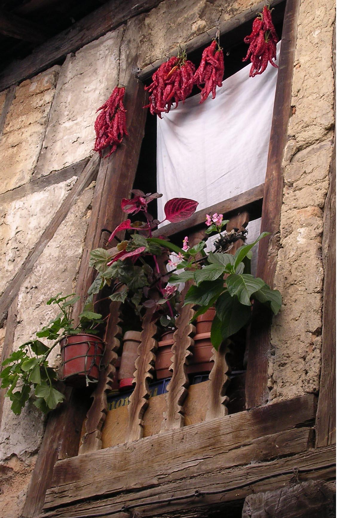 Peppers drying in a mountain villager's window